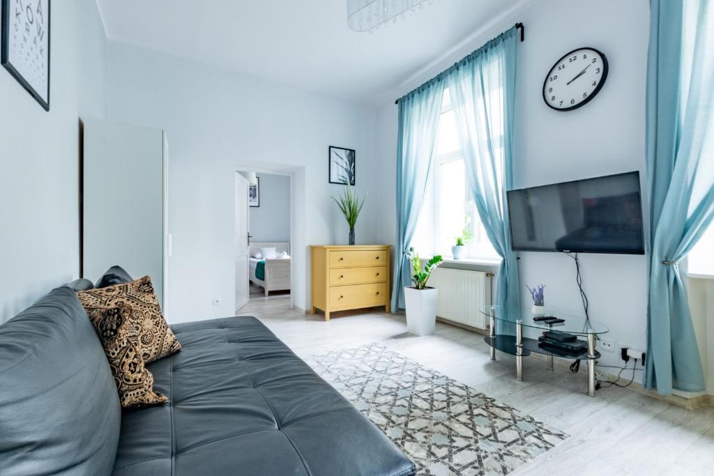 Televízia a/alebo spoločenská miestnosť v ubytovaní Wawel Castle Apartment