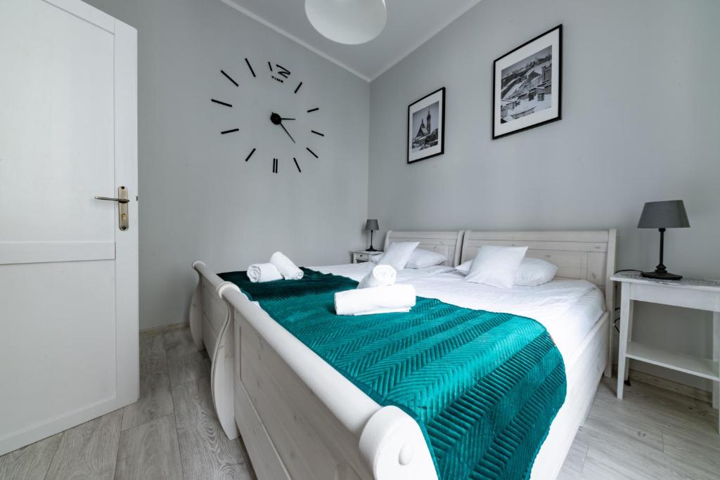 Posteľ alebo postele v izbe v ubytovaní Wawel Castle Apartment