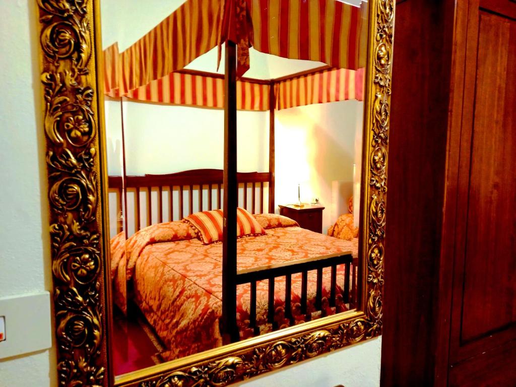 a bedroom with a bed in a mirror at Hotel Tourist House in Florence