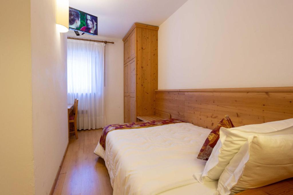 Postel nebo postele na pokoji v ubytování Hotel San Giusto