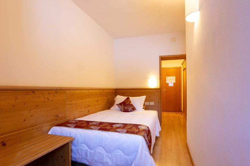 Postel nebo postele na pokoji v ubytování Hotel San Giusto