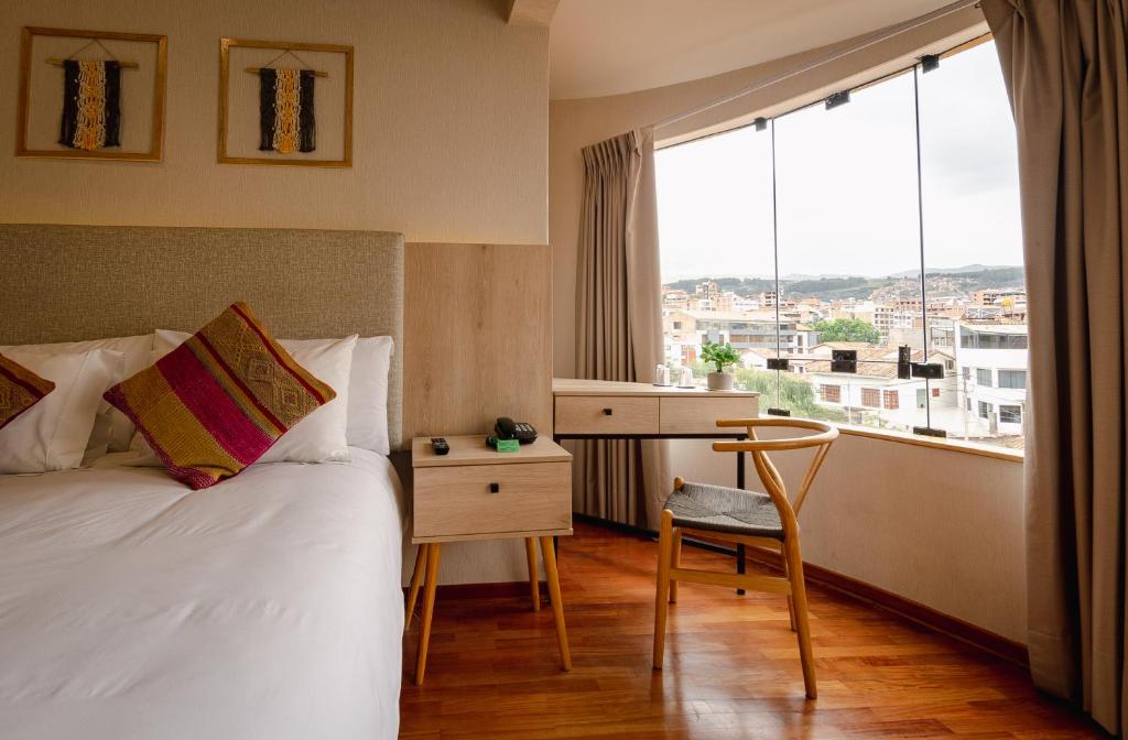 Postel nebo postele na pokoji v ubytování Torre Dorada Cusco