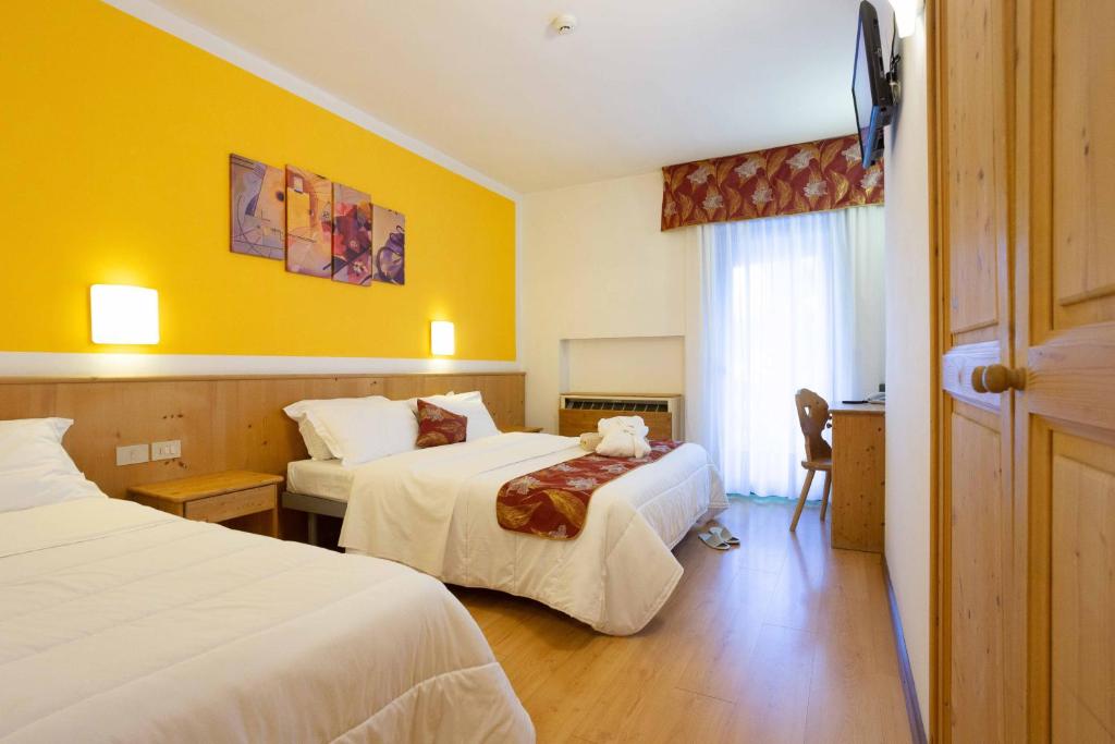 Postel nebo postele na pokoji v ubytování Hotel San Giusto