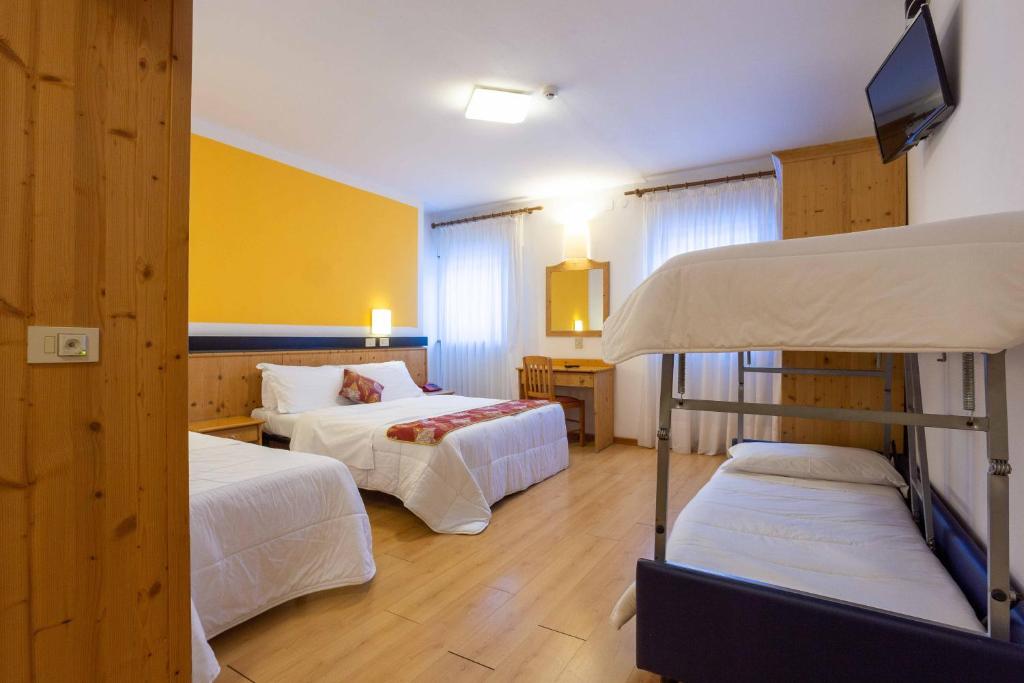 Postel nebo postele na pokoji v ubytování Hotel San Giusto