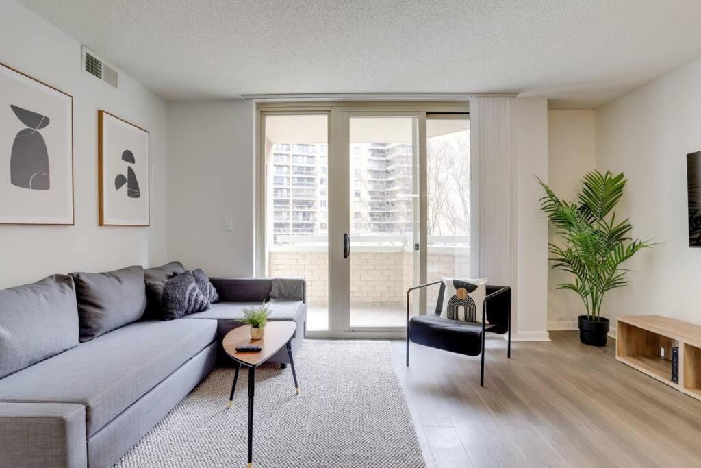 a living room with a couch and a table at Spacious Apartment With 2 Bedrooms in Arlington