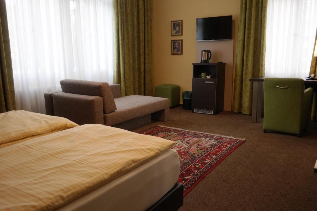 TV a/nebo společenská místnost v ubytování Hotel Villa Glas