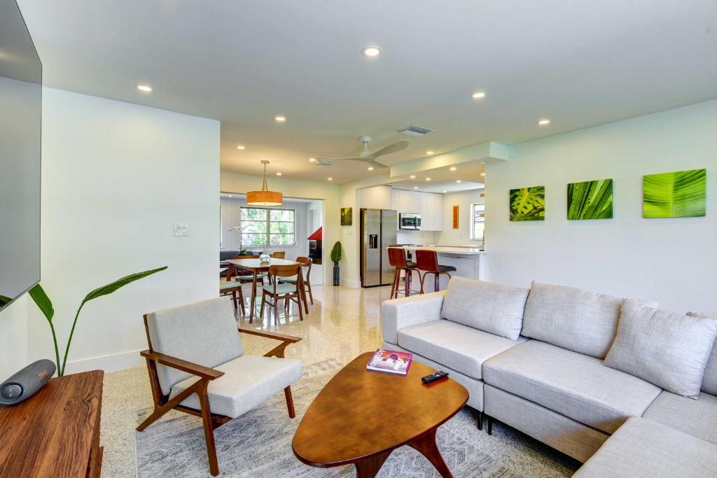 a living room with a couch and a table at Charming Sarasota Vacation Home Near Downtown in Sarasota
