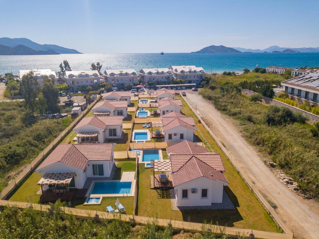 an aerial view of a row of houses by the water at SunTeos Villa Suites in Fethiye