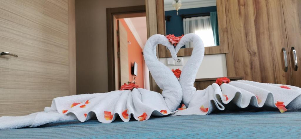 Postel nebo postele na pokoji v ubytování Loya Vita Hotel