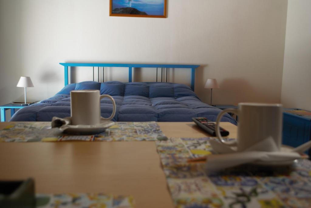 Łóżko lub łóżka w pokoju w obiekcie Al Mare In Città