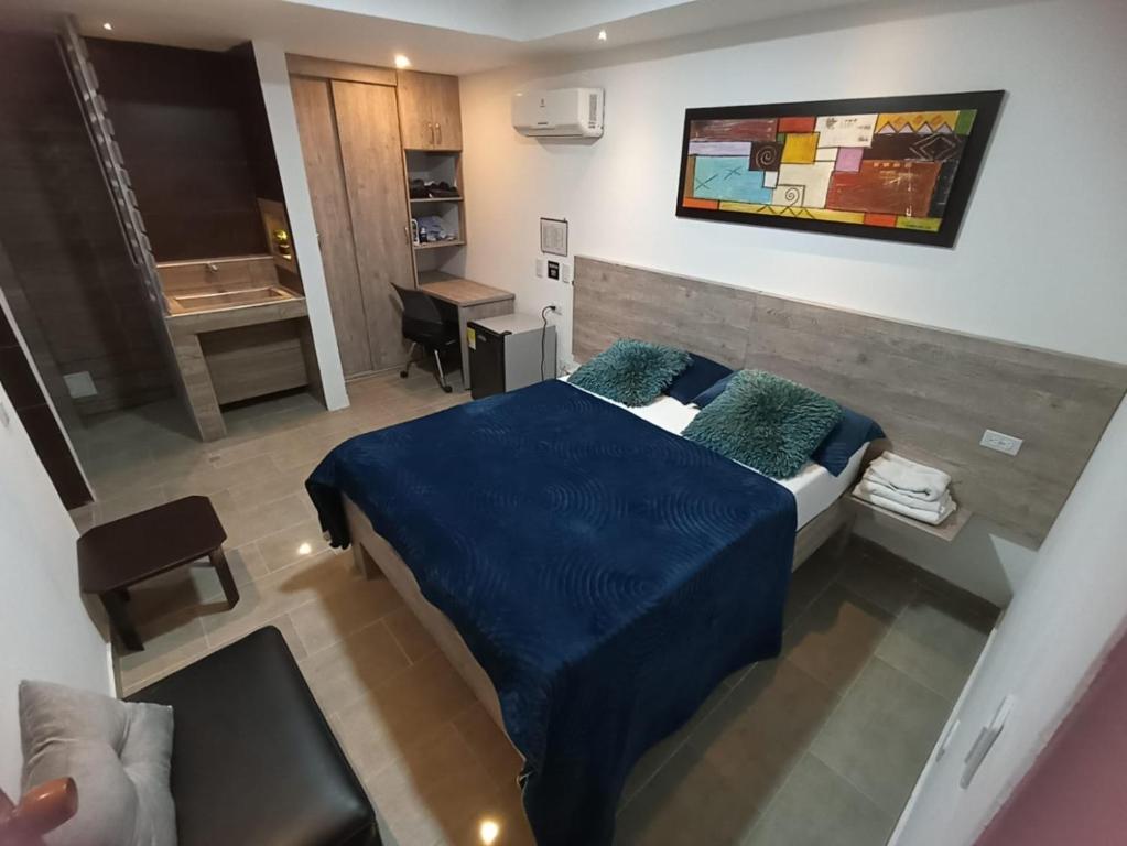 Un pat sau paturi într-o cameră la Hotel Plaza Norte Cali
