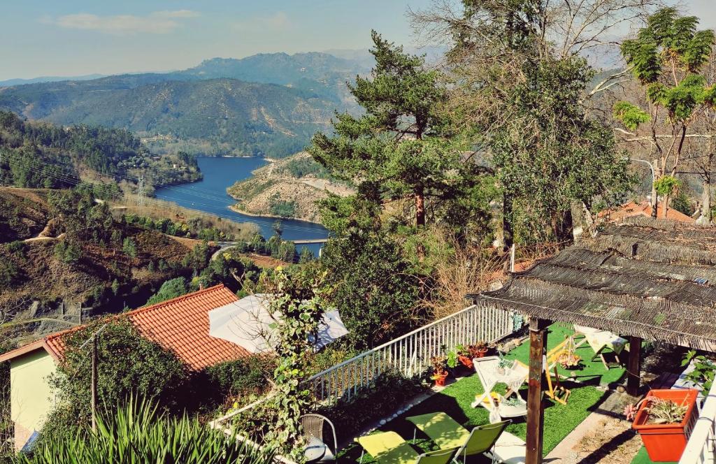 arial view of a house with a view of a river at Monteiro's Gerês Countryhouse in Ferral