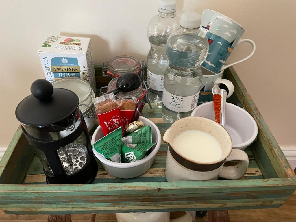 a tray with drinks and other items on a table at Southernhay in Beer