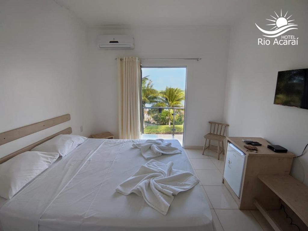 Postel nebo postele na pokoji v ubytování Hotel Rio Acaraí