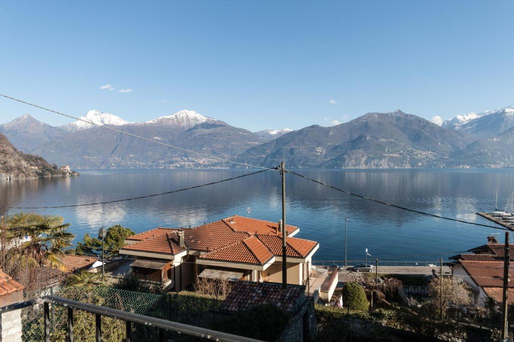 a house with a view of a lake and mountains at Casa Pina in Menaggio