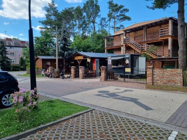 a building on the side of a street at Domki Pod Dębami in Pobierowo