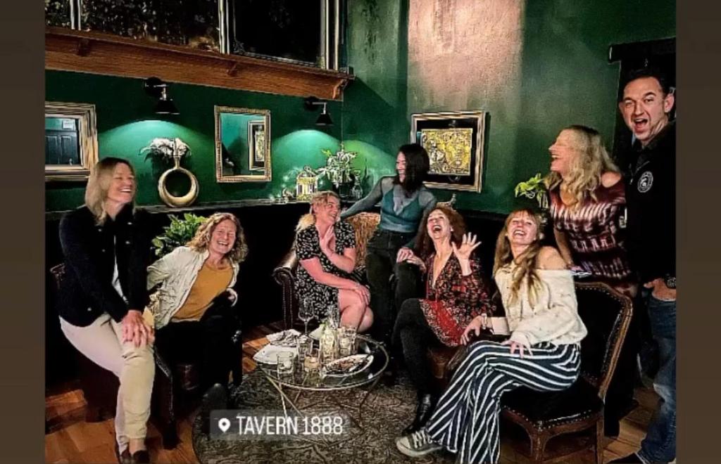 a group of people sitting in a room at The Inn at 2nd & C in Eureka