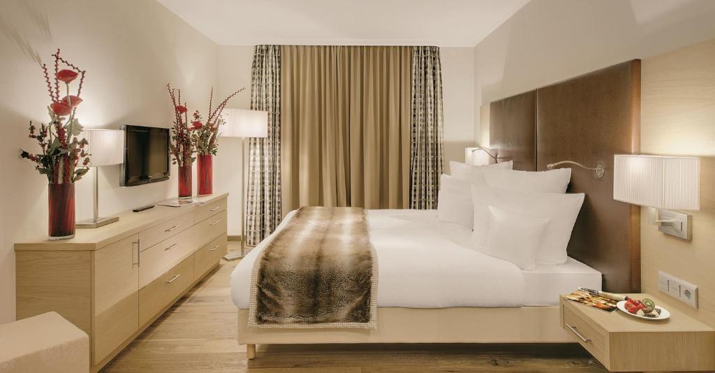 Postel nebo postele na pokoji v ubytování Hotel Sonnengut Wellness - Therme - Spa