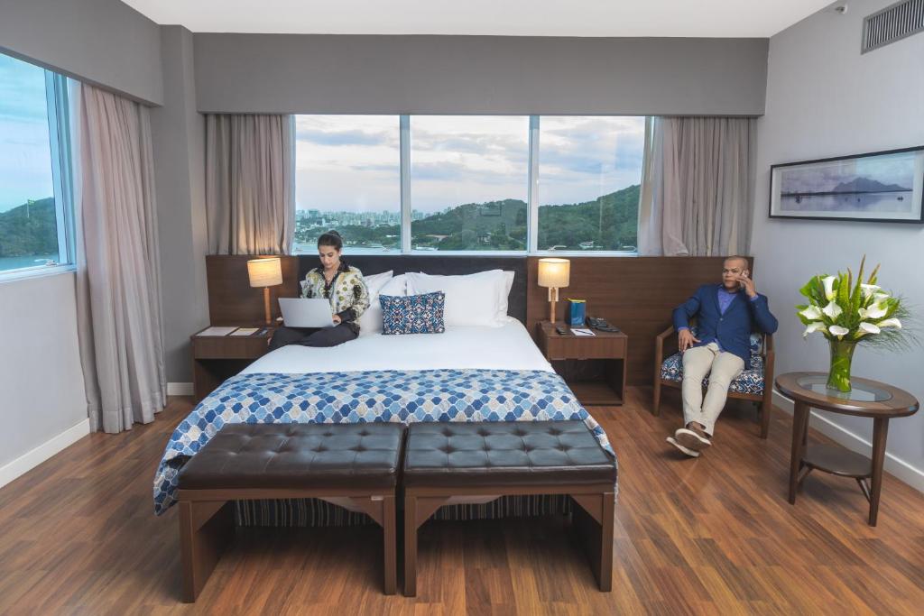Postel nebo postele na pokoji v ubytování Golden Tulip Porto Vitória