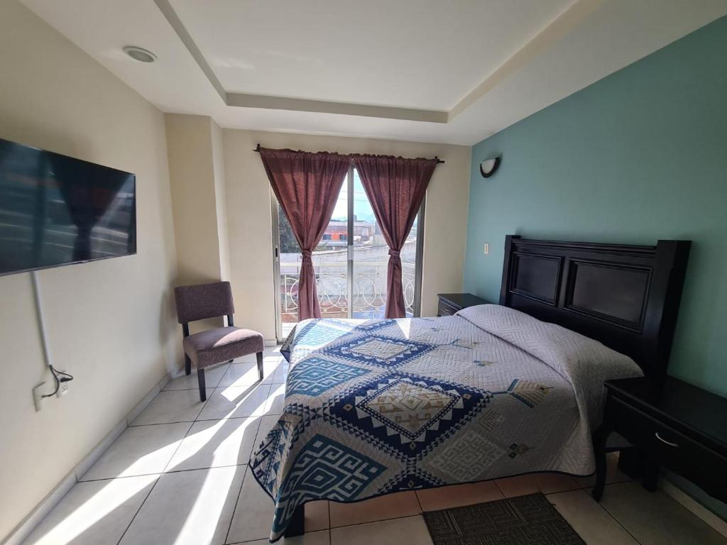 Postel nebo postele na pokoji v ubytování Hotel Santa Fe