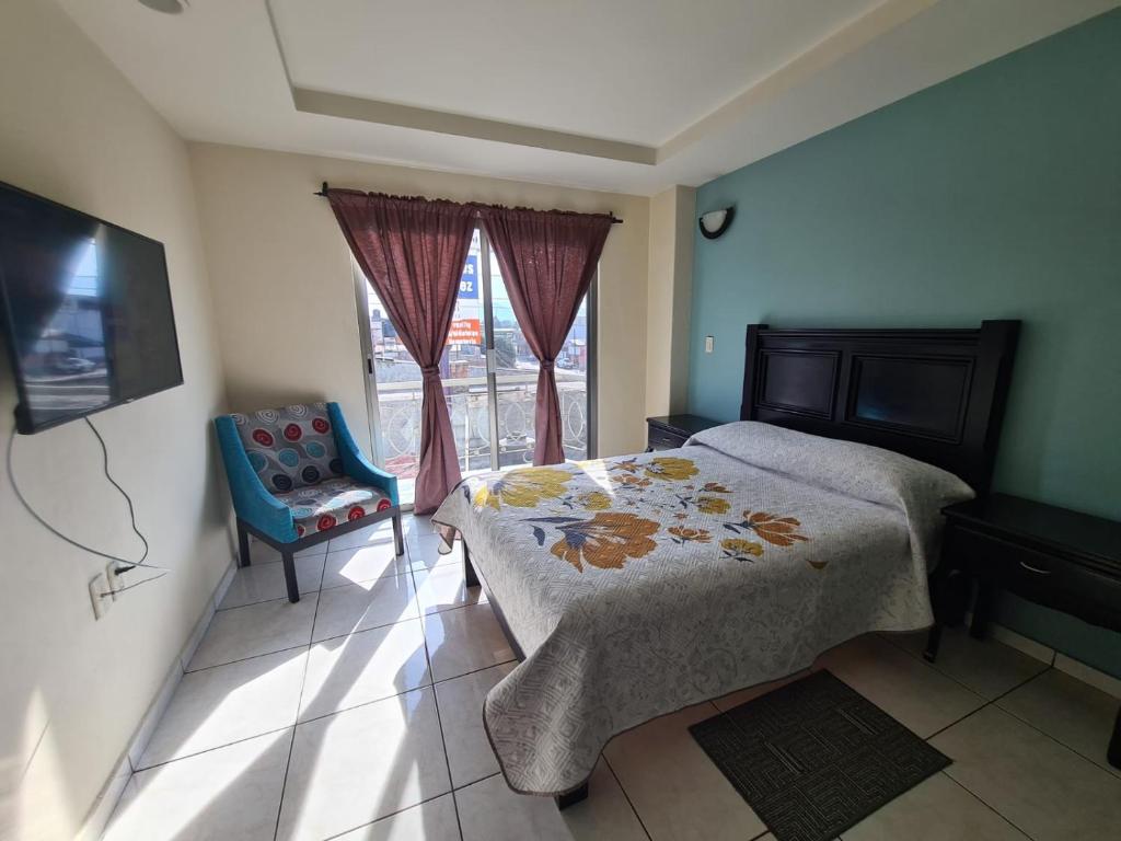 Postel nebo postele na pokoji v ubytování Hotel Santa Fe