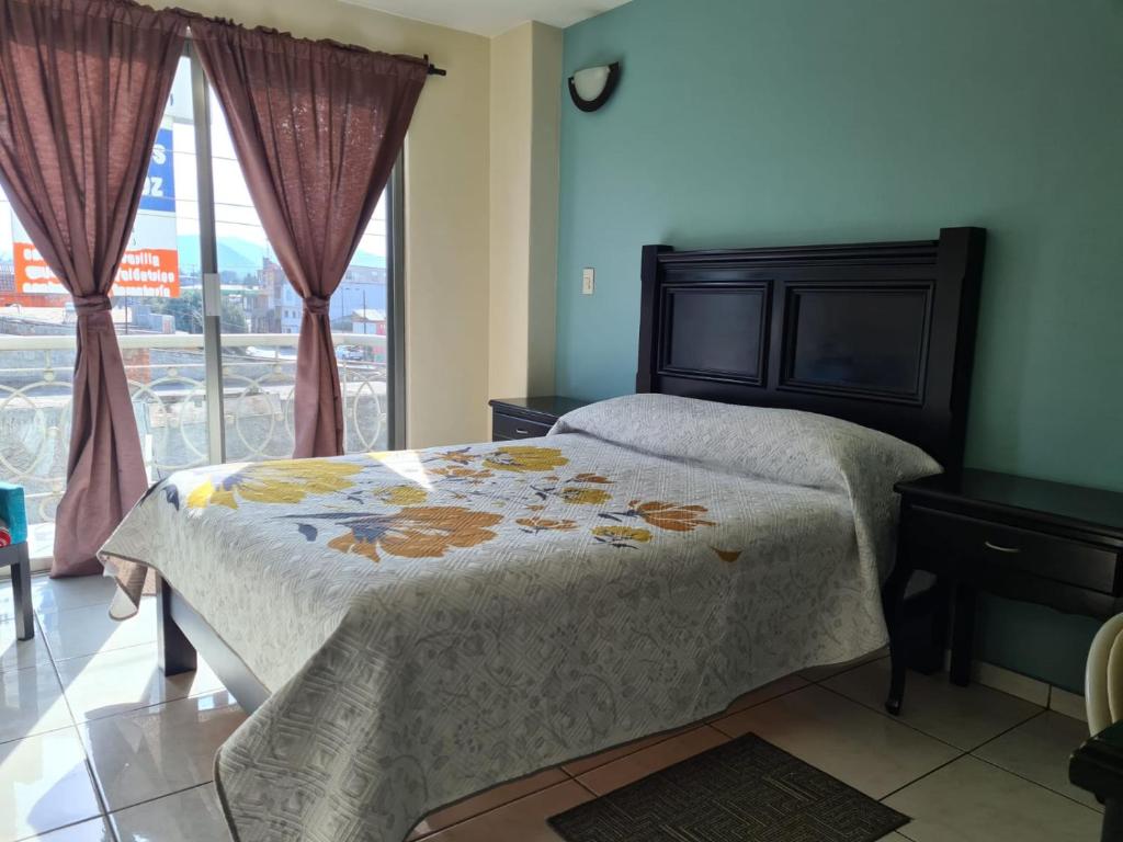 Postel nebo postele na pokoji v ubytování Hotel Santa Fe