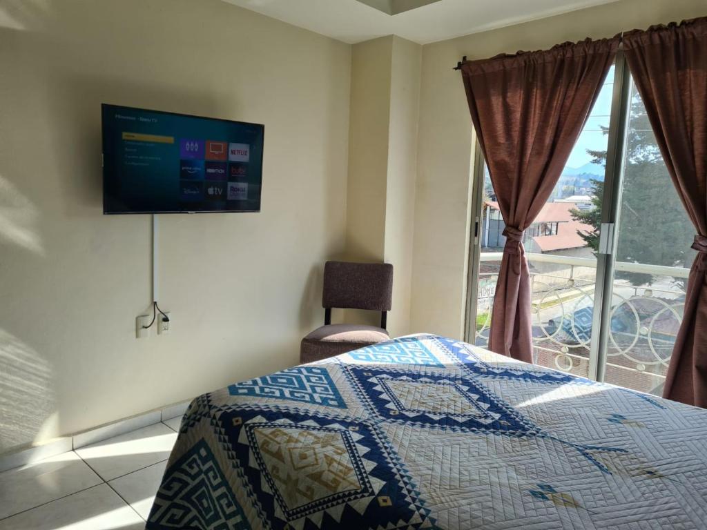 Postel nebo postele na pokoji v ubytování Hotel Santa Fe