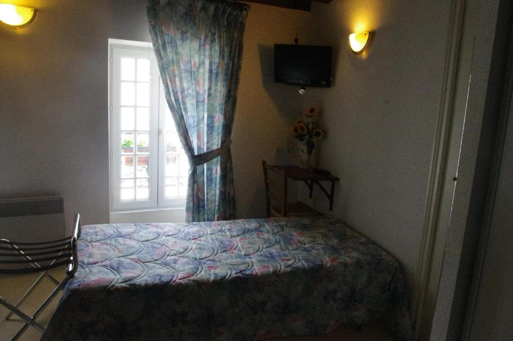 Postel nebo postele na pokoji v ubytování Hotel Chez Chaumat