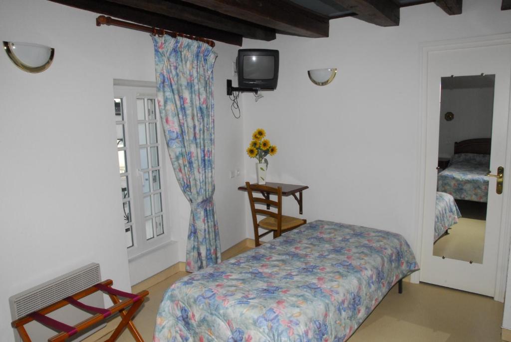 Postel nebo postele na pokoji v ubytování Hotel Chez Chaumat