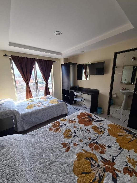 Postel nebo postele na pokoji v ubytování Hotel Santa Fe