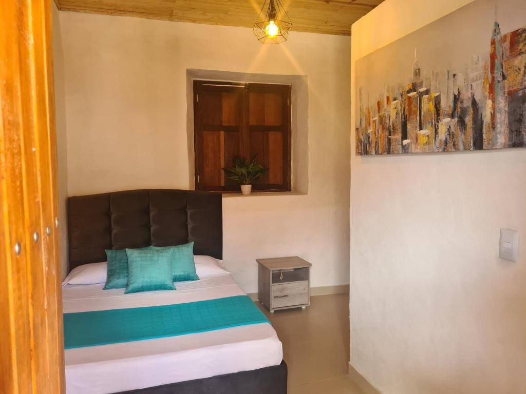 Postel nebo postele na pokoji v ubytování Hotel Alcázar Real