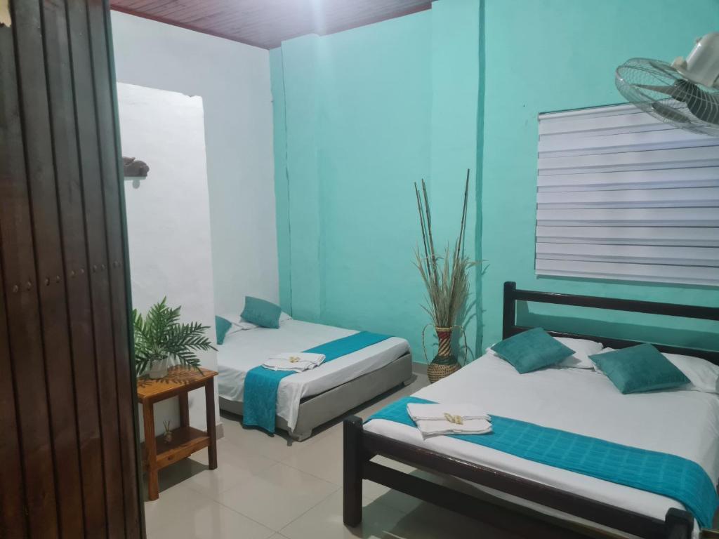 Postel nebo postele na pokoji v ubytování Hotel Alcázar Real