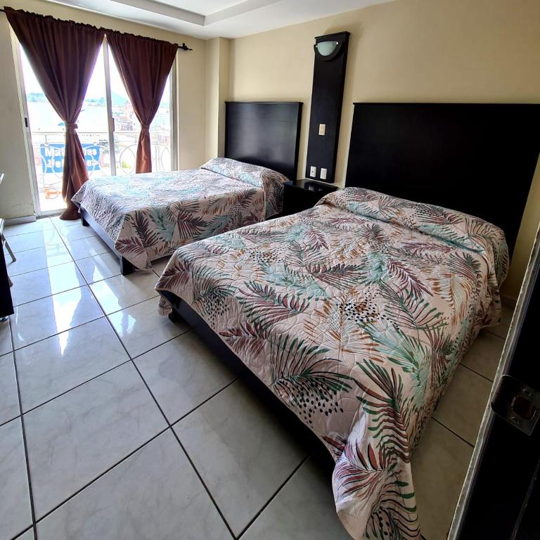 Postel nebo postele na pokoji v ubytování Hotel Santa Fe