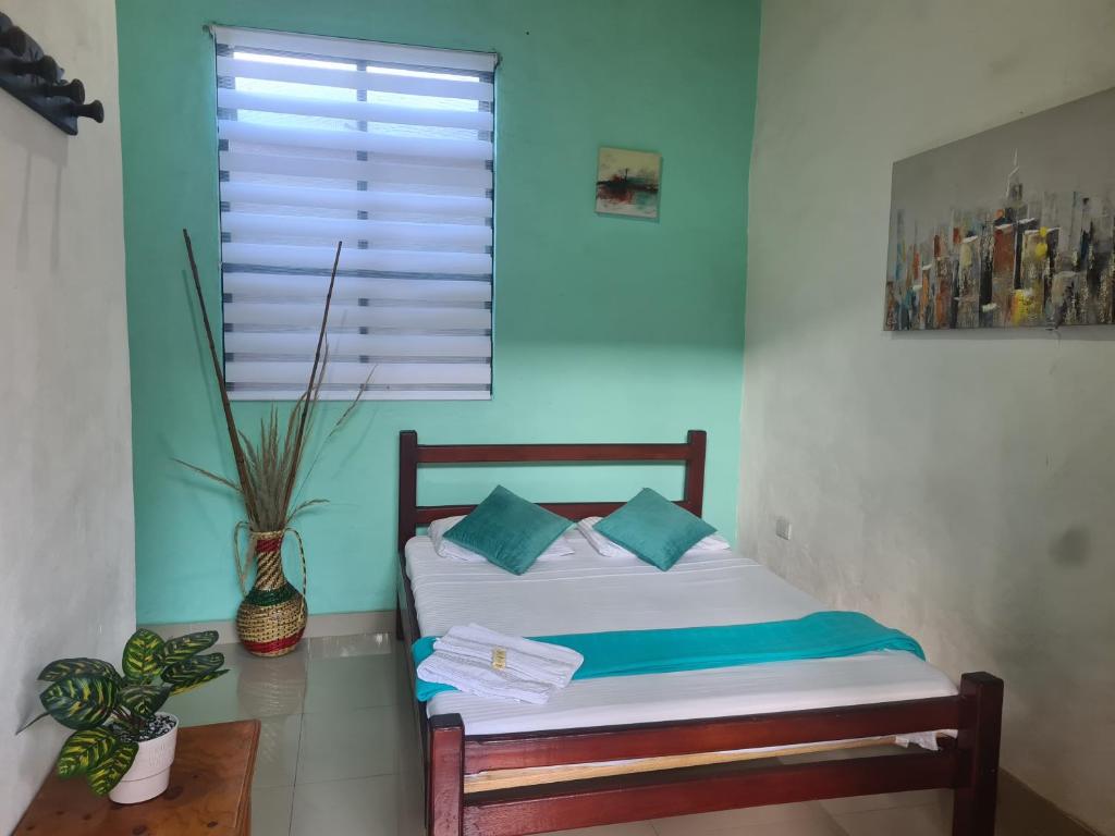 Postel nebo postele na pokoji v ubytování Hotel Alcázar Real