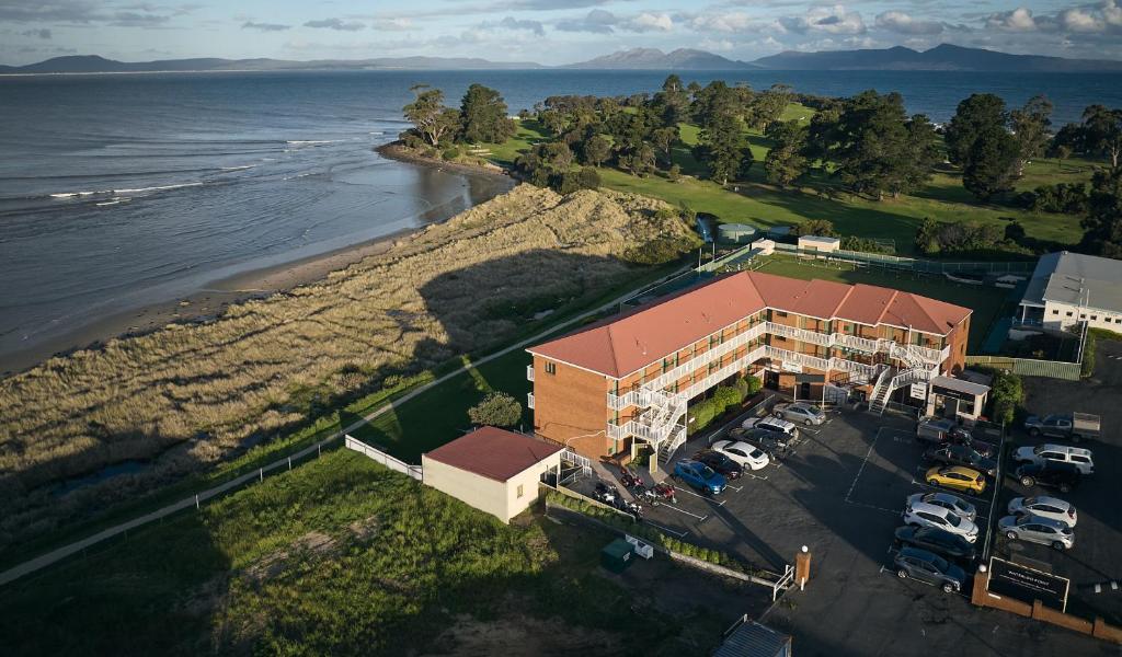 an aerial view of a building next to the water at The Waterloo Hotel in Swansea