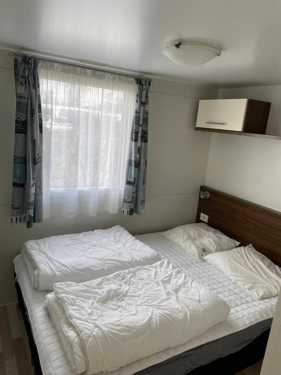 Voodi või voodid majutusasutuse Vorbasse camping toas