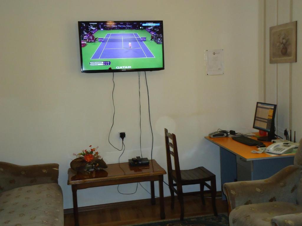 Sjónvarps- og/eða afþreyingartæki á Guest House Lviv Грузия