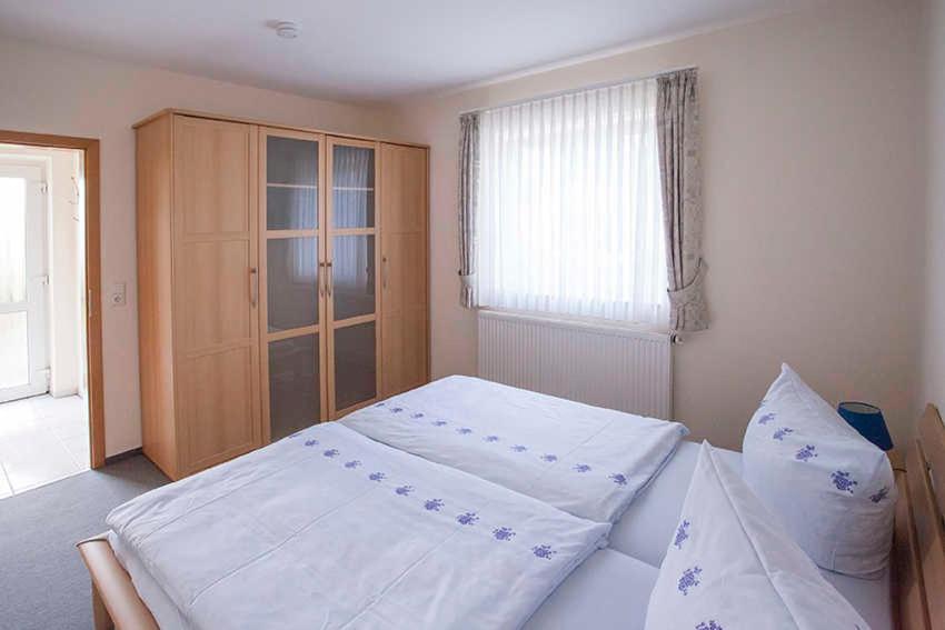 Postel nebo postele na pokoji v ubytování Haus Ulla