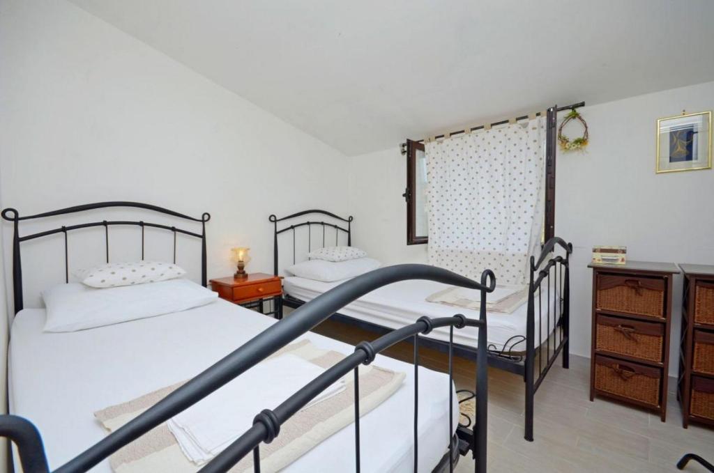 Postel nebo postele na pokoji v ubytování House Josko