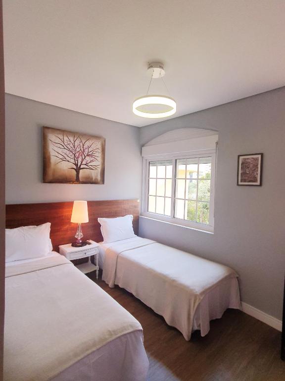 Postel nebo postele na pokoji v ubytování Hotel Pousada Pacaembu