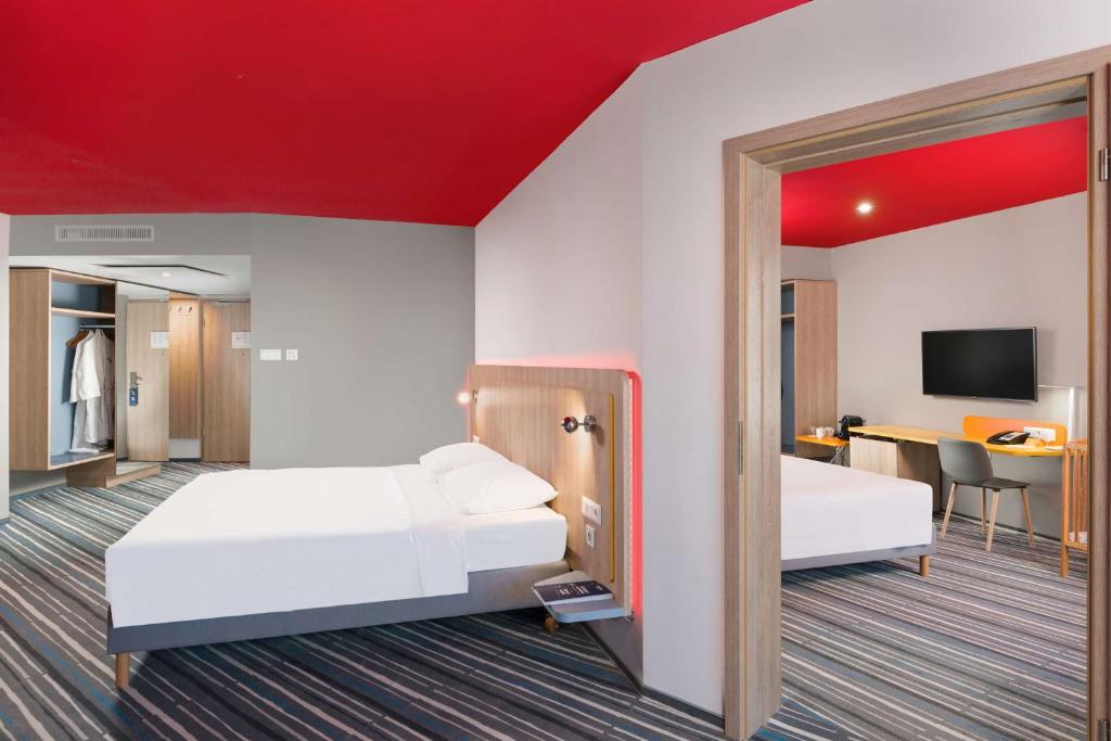 Postel nebo postele na pokoji v ubytování Park Inn By Radisson Zalakaros Hotel & Spa