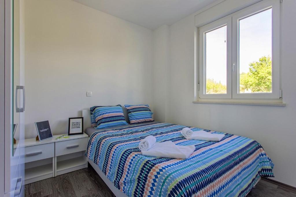 Posteľ alebo postele v izbe v ubytovaní Villa Mate in Kuhari - Haus für 8 Personen