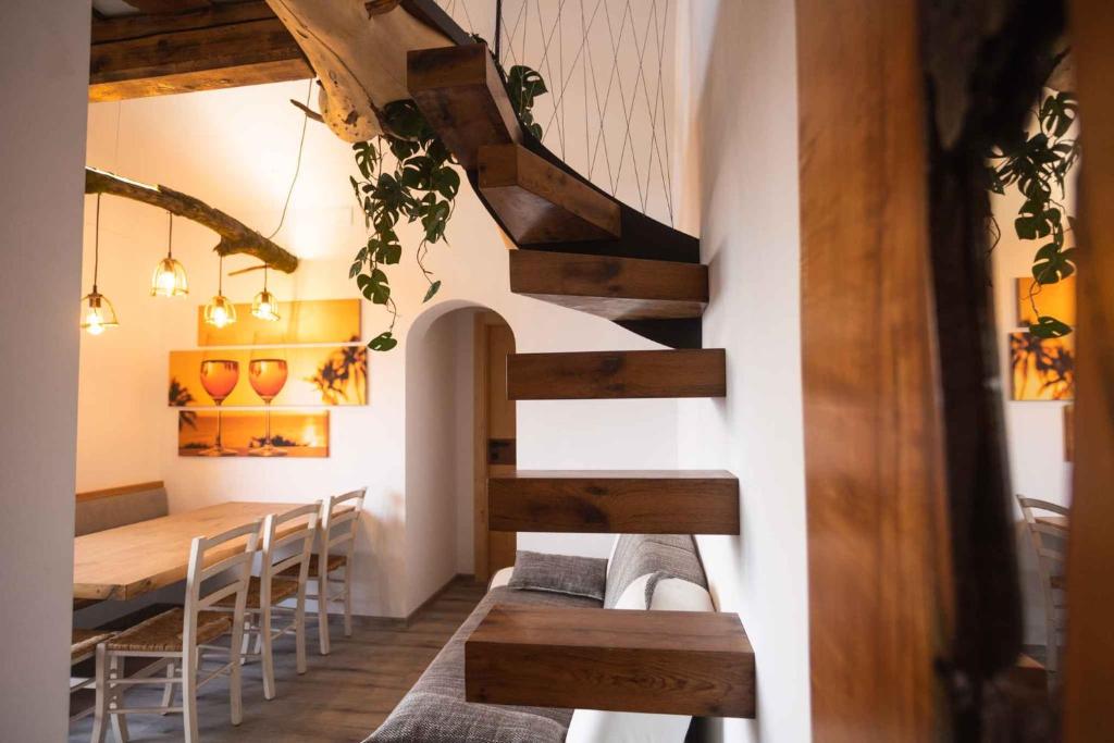 a staircase in a room with a table and chairs at Holiday home in Sentvid pri Sticni - Zentralslowenien 43927 in Šentvid pri Stični