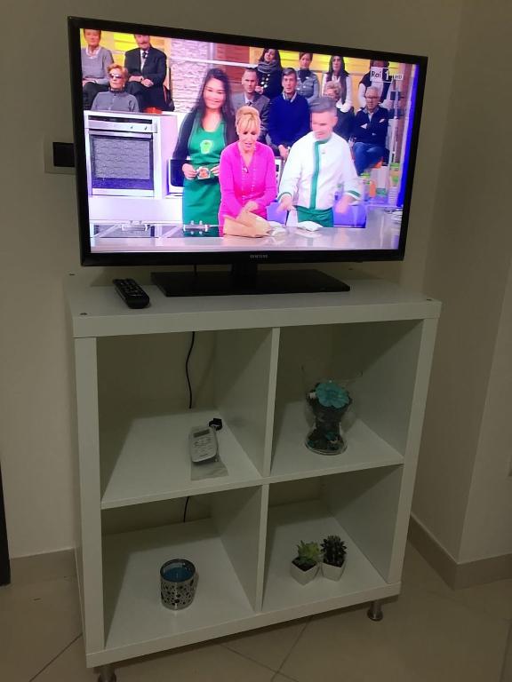 Telewizja i/lub zestaw kina domowego w obiekcie Apartments Casa Vacanze Dante