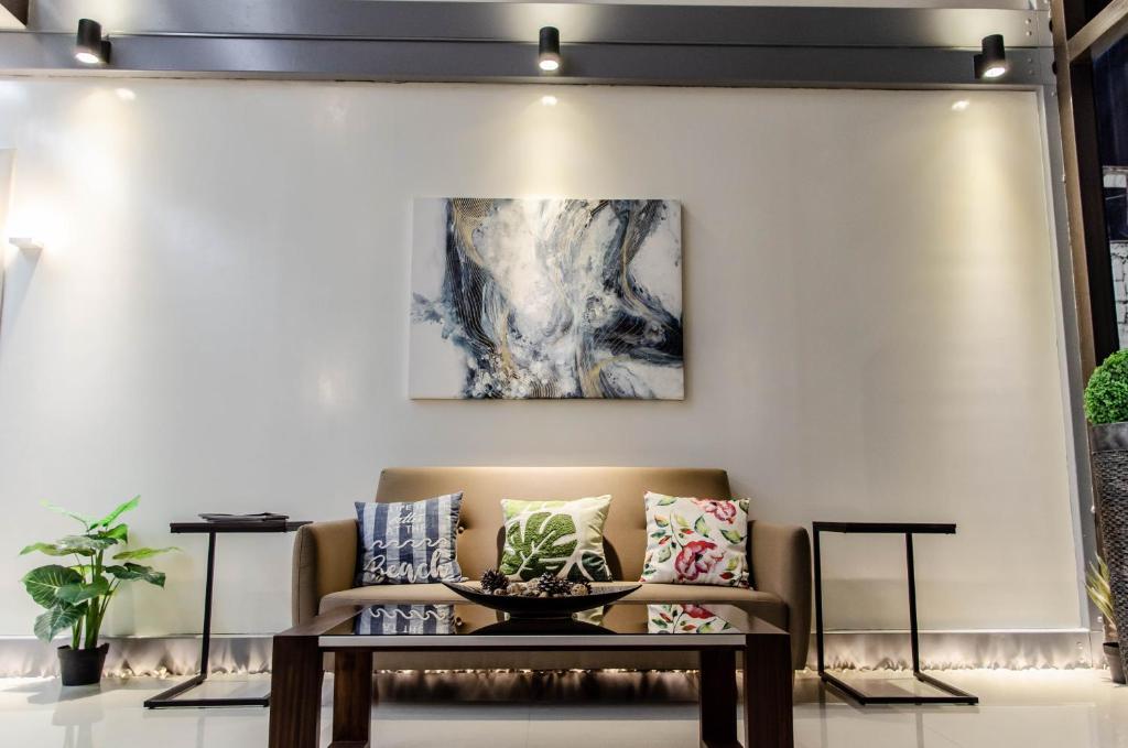 a living room with a couch and a table at Moriyama Hotel in Mandaue City