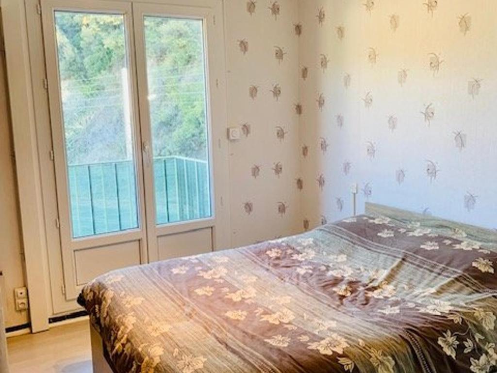 Posteľ alebo postele v izbe v ubytovaní Appartement F3 rénové, 2 à 6 pers, clim, wifi, garage fermé, animaux OK, Amélie-les-Bains - FR-1-703-31