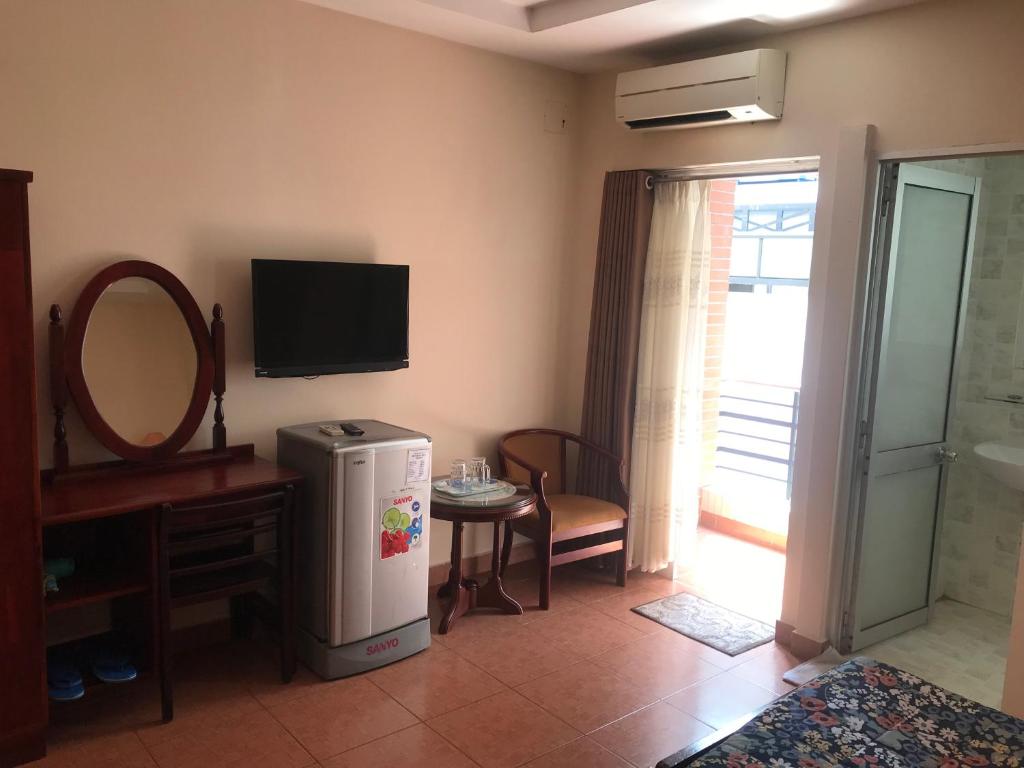 TV a/nebo společenská místnost v ubytování Kim Hotel