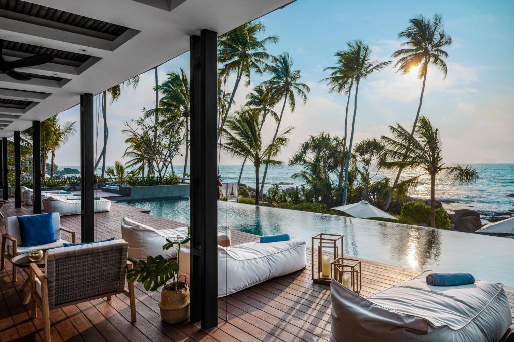 a view of the ocean from the balcony of a resort at Ahu Bay in Ahungalla