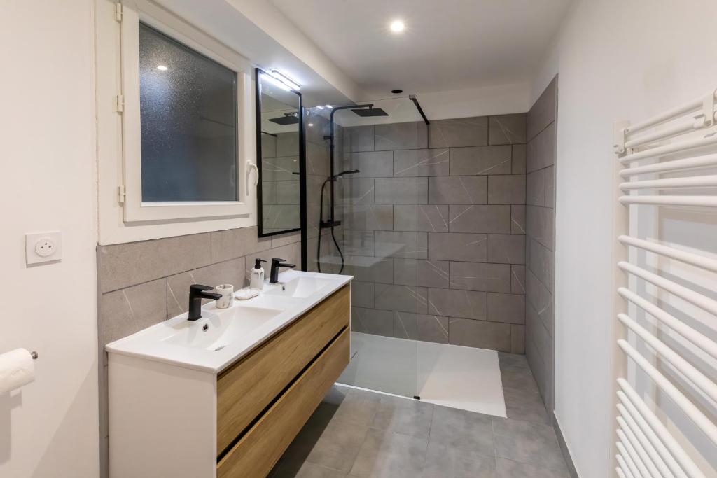 Kúpeľňa v ubytovaní Les appartements de Clélia