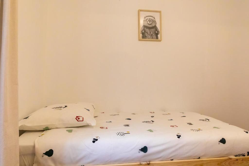 Posteľ alebo postele v izbe v ubytovaní Les appartements de Clélia